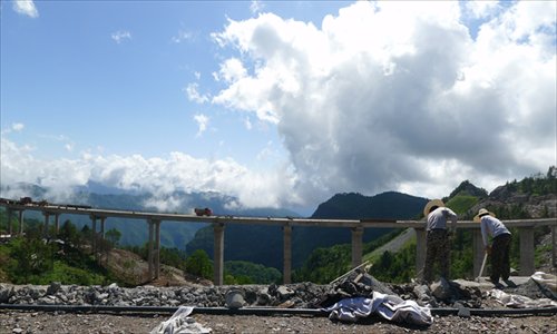 Two workers work at the construction site of the airport in Shennongjia, Hubei Province on June 25. Photo: Liu Dong/GT