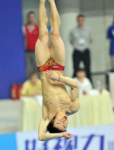 Qin Kai of China competes during the men's 3m springboard final at the FINA Diving World Series 2013 held at the Aquatics Center, in Beijing, capital of China, on March 16, 2013. Qin Kai claimed the champion with 548.65 points. (Xinhua/Li Wen) (lm)