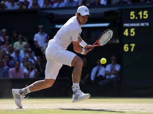 Andy Murray of Britain competes during the men's singles final with Novak Djokovic of Serbia on day 13 of the Wimbledon Lawn Tennis Championships at the All England Lawn Tennis and Croquet Club in London, Britain, July 7, 2013. Andy Murray on Sunday won his first Wimbledon title and ended Britain's 77-year wait for a men's champion with a 6-4 7-5 6-4 victory over world number one Novak Djokovic. (Xinhua/Wang Lili) 