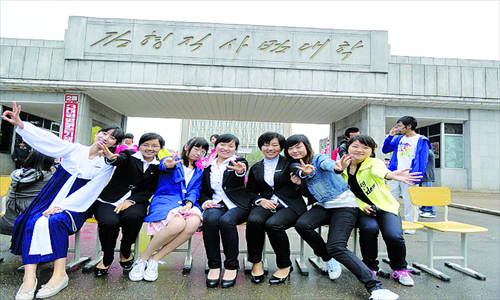 Chinese and North Korean students have fun posing for a group photo in front of the Kim Hyong Jik Normal University in Pyongyang, on October 15, 2011. Photo: Courtesy of Ke Juping