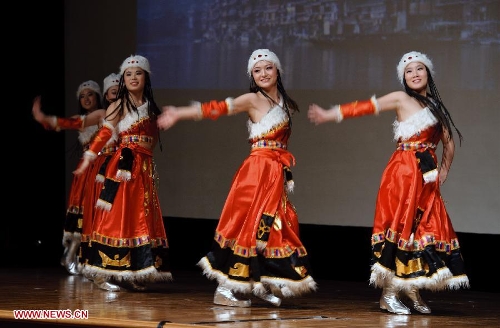 Chinese students studying in Russia dance during a performance staged at the Chinese Embassy in Moscow, Russia, Jan. 20, 2013. The performance was held here on Sunday in celebration of China's traditional Spring Festival and the upcoming Year of the Snake. (Xinhua/Jiang Kehong) 