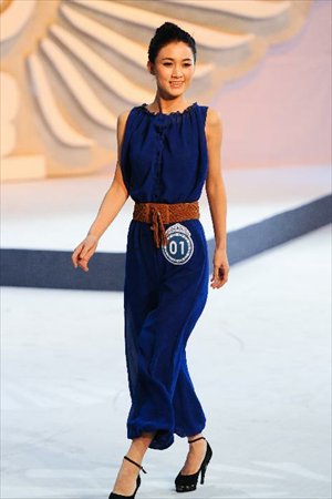 A contestant is pictured on the stage during a beauty contest in Changchun City, capital of northeast China's Jilin Province, Dec. 19, 2012. Photo: Xinhua