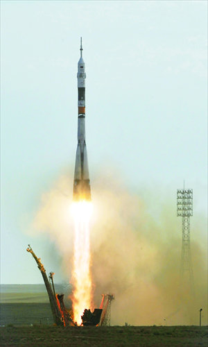 The Soyuz TMA-05M spacecraft blasts off from the Russian-leased Kazakh Baikonur Cosmodrome on Sunday. 