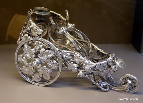 Photo taken on May 4, 2013 shows a 19th century silvering object carrying wines displayed in an exhibition of 