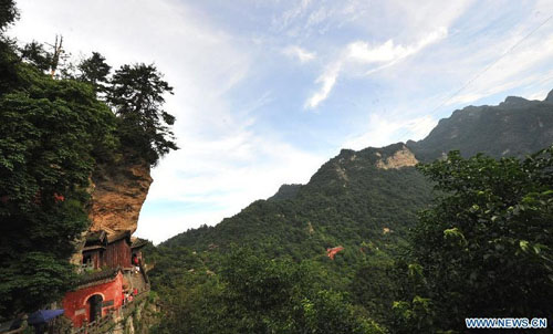 Photo taken on July 11, 2012 shows the scenery of Wudang Mountain in central China's Hubei Province. As the cradle of the Taoist culture, the Wudang Mountain was inscribed on the list of World Cultural Heritages in 1994. The scenery of the mountain attracts tens of thousands of visitors every year. Over 4 million tourists from at home and abroad are expected to visit the site this year. Photo: Xinhua