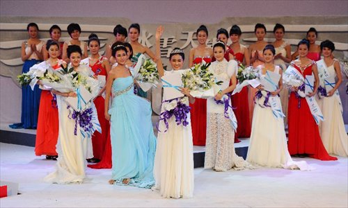 Contestants attend the award ceremony of a beauty contest in Changchun City, capital of northeast China's Jilin Province, Dec. 19, 2012. Photo: Xinhua