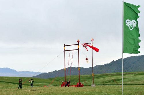 Tourists visit a forest and grass area in the Yugur Autonomous County of Sunan, Northwest China's Gansu Province, July 23, 2012. Gansu's Sunan County has become a populous tourists site in recent years, boasting its diversified scenic view, including snow mountains, grasslands, valleys, deserts and lakes.