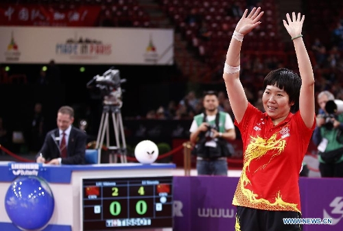  Li Xiaoxia of China celebrates after winning the final of women's singles against her teammate Liu Shiwen at the 2013 World Table Tennis Championships in Paris, France on May 19, 2013. Li won 4-2 to claim the title. (Xinhua/Wang Lili) 