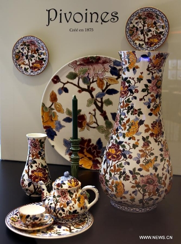 Photo taken on May 4, 2013 shows a set of classic tableware displayed in an exhibition of 