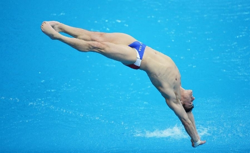 Troy Dumais of the United States competes during the men's 3m springboard semifinal at the FINA Diving World Series 2013 held at the Aquatics Center, in Beijing, capital of China, on March 16, 2013. (Xinhua/Tao Xiyi)