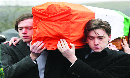 The coffin of convicted Old Bailey bomber Dolours Price is carried by her two sons Danny (left) and Oscar (right) to St Agnes Church in west Belfast, Northern Ireland, on Monday.  Price, convicted for the infamous Irish Republican Army bombing of the Old Bailey court in London in 1973, was found dead at her home in Ireland, her family said on Thursday. Photo: AFP
