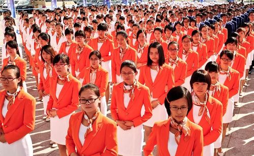 Volunteers attend an inauguration ceremony before the sixth Annual Meeting of the New Champions in Tianjin, North China, September 5, 2012. The sixth Annual Meeting of the New Champions, also known as the Summer Davos Forum, will be held in Tianjin on September 11, 2012. Photo: Xinhua

