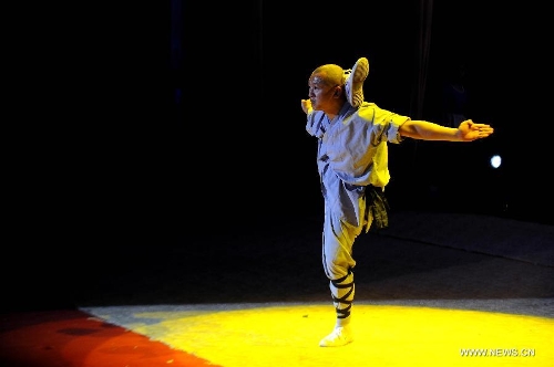 A performer of the Yandong Shaolin Kungfu troupe shows 