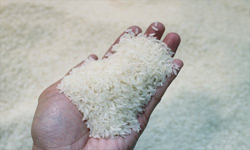 A man inspects rice at a market in Fuzhou, Fujian Province, on May 6. Photo: CFP