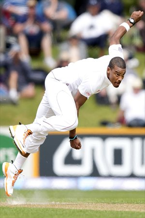 Shane Shillingford of the West Indies bowls during day one of the first international cricket Test match between New Zealand and the West Indies at the University Oval in Dunedin, New Zealand on Tuesday. New Zealand were leading 367 for three at the close of the first day. Photo: AFP