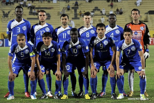 Players of Tajikistan's Ravshan SC pose for a group photo before the AFC Cup football match against Kuwait's Qadsia SC in Kuwait City, Kuwait, on April 3, 2013. Qadsia won the match 3-0. (Xinhua/Noufal Ibrahim)  