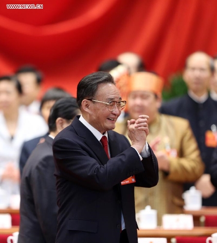 Wu Bangguo greets attendees prior to the second plenary meeting of the first session of the 12th National People's Congress (NPC) at the Great Hall of the People in Beijing, capital of China, March 8, 2013. (Xinhua/Pang Xinglei)Special Report: NPC, CPPCC Annual Sessions 2013