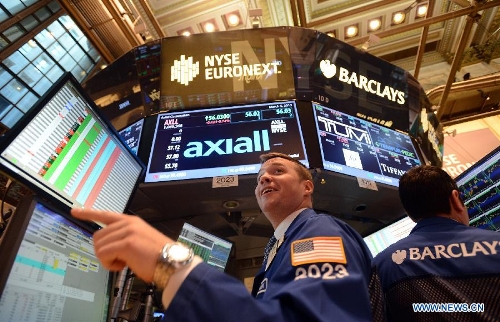 Traders work on the floor of the New York Stock Exchange on March 6, 2013. U.S. stocks surged on Tuesday, with the Dow Jones Industrial Average setting all-time closing high and intra-day high, as investors became more confident in the stock market. (Xinhua/Wang Lei) 