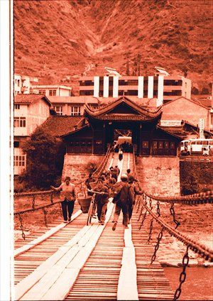 Villagers cross the Luding Bridge in Sichuan Province, site of a 1935 battle during the Long March.