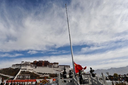 A flag-raising ceremony is held in front of the Potala Palace to mark the 54th anniversary of the abolishment of Tibet's feudal serfdom in Lhasa, capital of southwest China's Tibet Autonomous Region, March 28, 2013. Authorities have designated March 28 as the day to commemorate the 1959 democratic reform in Tibet, which ended the feudal serf system. The reform freed about 1 million Tibetans, over 90 percent of the region's population at the time, from a life of serfdom. (Xinhua/Purbu Zhaxi) 