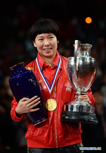  Li Xiaoxia of China poses with the trophy during the awarding ceremony for women's singles at the 2013 World Table Tennis Championships in Paris, France on May 19, 2013. Li claimed the title by defeating her teammate Liu Shiwen with 4-2. (Xinhua/Tao Xiyi) 