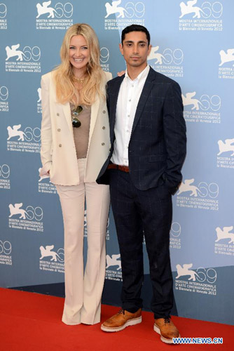 Actress Kate Hudson(L) and actor Riz Ahmed pose for photos at the photocall of the opening film 