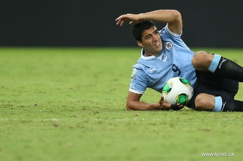 Uruguay's Luis Suarez reacts during the FIFA's Confederations Cup Brazil 2013 semifinal match against Brazil, held at Mineirao Stadium, in Belo Horizonte, Minas Gerais state, Brazil, on June 26, 2013. (Xinhua/Liao Yujie)