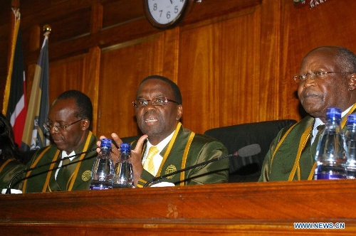 Kenya's Chief Justice Dr. Willy Mutunga (C) speaks at the Supreme Court in Nairobi, capital of Kenya, March 30, 2013. Kenya's Supreme Court on Saturday upheld Uhuru Kenyatta as the duly elected fourth president of Kenya after reaching unanimous decision. (Xinhua/Charles Charles Onyango) 