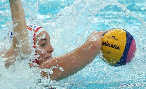 M. Carmen Garcia of Spain shoots during the final for the 5th and 6th rank against Italy at the 2013 FINA Women's Water Polo World League Super Final in Beijing, capital of China, June 6, 2013. Spain won 10-8 to rank the 5th of the event. (Xinhua/Li Ming) 