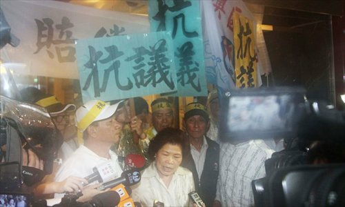 The wife of Hung Shih-cheng, the Taiwanese fisherman shot dead by Philippine coast guard on May 9, is interviewed by journalists on May 13 near the Manila Economic and Cultural Office in Taipei. She appealed for a formal apology from the Philippine government. Photo: China News Service