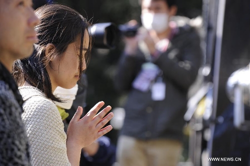  People attend a mourning ceremony in Tokyo, capital of Japan, on March 11, 2013. A mourning ceremony was held here Monday to mark the two year anniversary of the March 11 earthquke and ensuing tsunami that left more than 19,000 people dead or missing and triggered a nuclear accident the world had never seen since 1986. (Xinhua/Kenichiro Seki) 