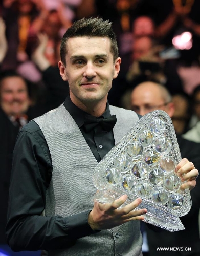 Mark Selby of England poses with his trophy after the final match against Neil Robertson of Australia at the 2013 Masters snooker tournament at Alexandra Palace in London, Britain, Jan. 20, 2013. Selby won 10-6 in the final early Monday to claim the title. (Xinhua/Yin Gang) 