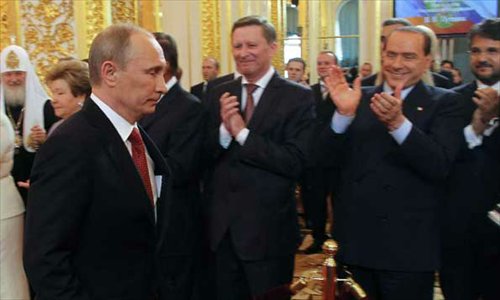 Vladimir Putin walks during the inauguration ceremony at the Kremlin in Moscow, Russia, May 7, 2012. Putin was sworn in on Monday as Russian president, starting his third term in the Kremlin following the two consecutive terms from 2000 to 2008. Photo: Xinhua/RIA Novosti