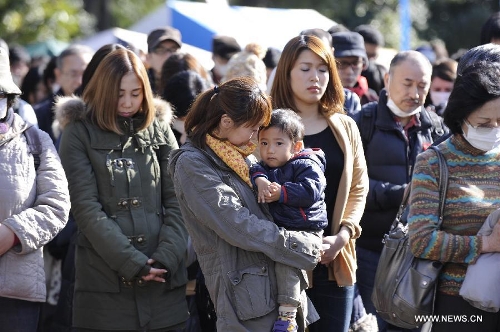  People attend a mourning ceremony in Tokyo, capital of Japan, on March 11, 2013. A mourning ceremony was held here Monday to mark the two year anniversary of the March 11 earthquke and ensuing tsunami that left more than 19,000 people dead or missing and triggered a nuclear accident the world had never seen since 1986. (Xinhua/Kenichiro Seki) 