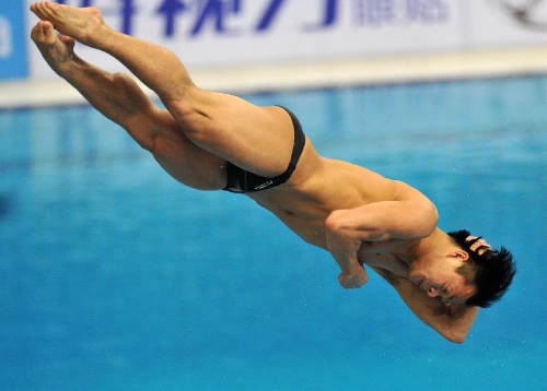 He Chong of China competes during the men's 3m springboard final at the FINA Diving World Series 2013 held at the Aquatics Center, in Beijing, capital of China, on March 16, 2013. He Chong took the 2nd place with 521.50 points. (Xinhua/Gong Lei)