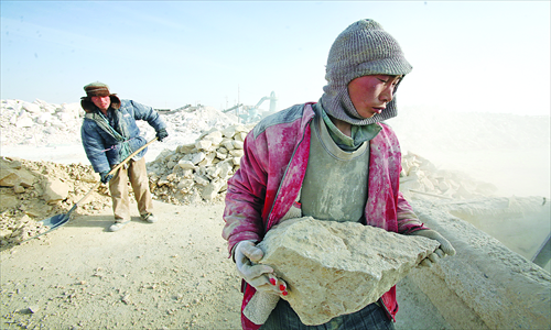 Two reportedly enslaved men work at a building-materials factory in Toksun county, Xinjiang Uyghur Autonomous Region. Photo: CFP