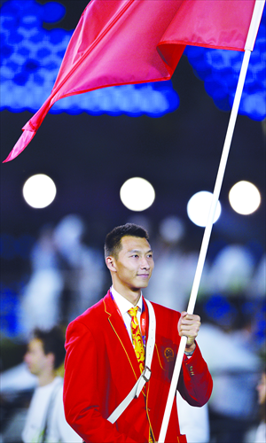 Yi Jianlian, basketball player, carries the flag for China during the opening ceremony of 2012 London Olympic Games. Photo: AFP