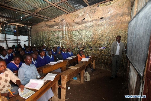 Pupils have a mathematics course at Mcedo Beijing School in Nairobi, capital of Kenya, April 11, 2013. Mcedo Beijing School is located in Mathare slum, one of the largest slums in Kenya and home to about 500,000 residents. The school offered mathematics, English, Swahili, science and some other courses for over 600 students living in three nearby regions. Pupils got free lunch in the school thanks to the United Nations World Food Programme. (Xinhua/Meng Chenguang) 