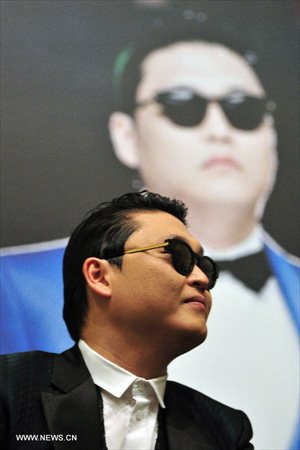 South Korean pop singer Psy attends a press conference before his performance in Singapore , December 1, 2012. (Xinhua/Then Chih Wey)


