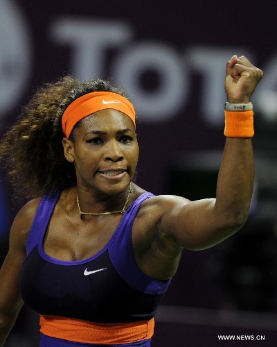 Serena Williams of the United States celebrates after scoring during the women's semifinal against Maria Sharapova of Russia at the Qatar Open tennis tournament in Doha, capital of Qatar, Feb. 16, 2013. Serena Williams won 2-0. (Xinhua/Chen Shaojin) 