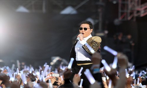 Psy performs during the solo concert 'Happening' of the new song 'Gentleman' in Seoul on April 13, 2013. Photo: CFP 