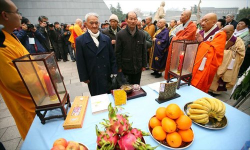 Nanjing Massacre survivors attend a religious service at the Memorial Hall of the Victims in Nanjing Massacre by Japanese Invaders in Nanjing, capital of east China's Jiangsu Province, December 13, 2012, to mark the 75th anniversary of the Nanjing Massacre. Nanjing was occupied on December 13, 1937, by Japanese troops who began a six-week massacre. Records show more than 300,000 Chinese unarmed soldiers and civilians were killed. Photo: Xinhua