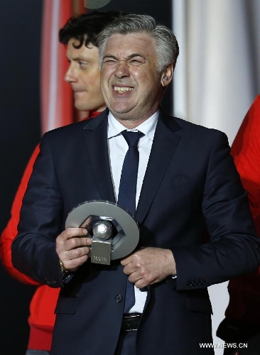 Paris Saint-Germain's manager Carlo Ancelotti reacts during the celebration for winning the French League 1 title after the League 1 football match between Paris St Germain and Brest at Parc des Princes stadium in Paris on May 18, 2013. (Xinhua/Wang Lili) 