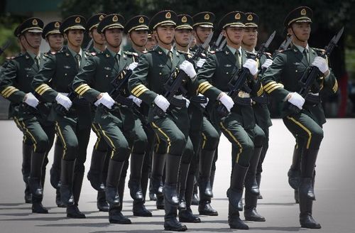 The honor guard of the Chinese People's Liberation Army (PLA) Garrison in the Hong Kong Special Administrative Region (HKSAR) perform on the opening ceremony of Hong Kong Youth Military Summer Camp at the San Wai Barracks of the Garrison in South China's Hong Kong, July 16, 2012. Photo: Xinhua