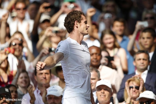 Andy Murray of Britain celebrates after winning the men's singles final with Novak Djokovic of Serbia on day 13 of the Wimbledon Lawn Tennis Championships at the All England Lawn Tennis and Croquet Club in London, Britain, on July 7, 2013. Andy Murray on Sunday won his first Wimbledon title and ended Britain's 77-year wait for a men's champion with a 6-4 7-5 6-4 victory over world number one Novak Djokovic. (Xinhua/Wang Lili) 