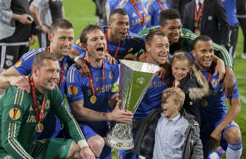 Chelsea's players and their family members celebrate with the trophy after the Europa League final soccer match against Benfica in Amsterdam, the Netherlands, on May 15, 2013. Chelsea won 2-1 to claim the title. (Xinhua/Rick Nederstigt) 