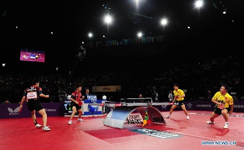  Chen Chien-An (1st L) and Chuang Chih-Yuan (2nd L) of Chinese Taipei celebrate scoring during the final of men's doubles against Hao Shuai and Ma Lin of China at the 2013 World Table Tennis Championships in Paris, France on May 19, 2013. Chen and Chuang won 4-2. (Xinhua/Tao Xiyi) 