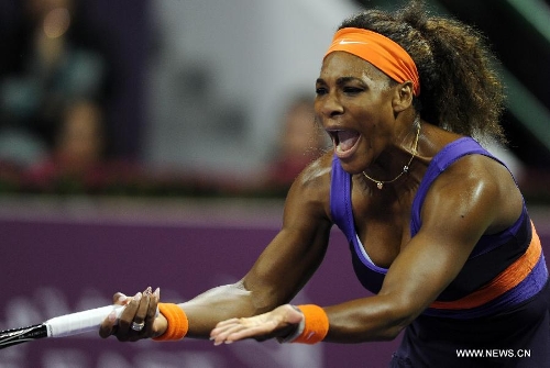 Serena Williams of the United States reacts after losing a point during the women's semifinal against Maria Sharapova of Russia at the Qatar Open tennis tournament in Doha, capital of Qatar, Feb. 16, 2013. Serena Williams won 2-0. (Xinhua/Chen Shaojin) 