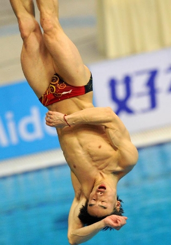 Qin Kai of China competes during the men's 3m springboard final at the FINA Diving World Series 2013 held at the Aquatics Center, in Beijing, capital of China, on March 16, 2013. Qin Kai claimed the champion with 548.65 points. (Xinhua/Gong Lei)