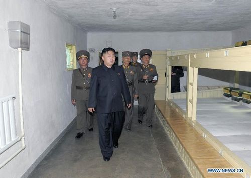 Photo provided by the Central News Agency (KCNA) of the Democratic People's Republic of Korea (DPRK) on August 28, 2012 shows DPRK top leader Kim Jong Un (2nd L) inspecting the command of the Korean People's Army (KPA) large combined unit 313 and a unit under it, which stand guard over the eastern sector of the front. Photo: Xinhua